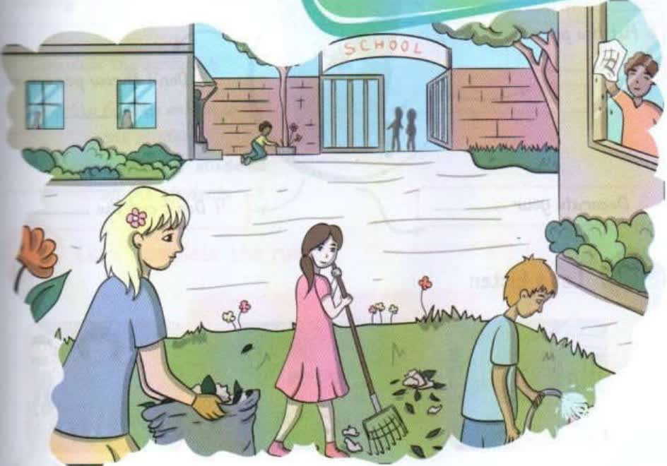Children cleaning the school garden: collecting rubbish, raking leaves and watering plants